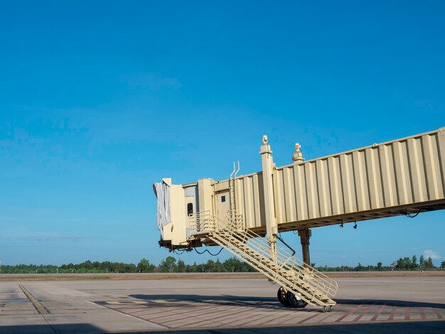 A photo of a shipping container being loaded onto a cargo ship at a bustling port in Shenzhen, China. Workers in hard hats can be seen overseeing the operation, and various stacks of containers are visible in the background. The image conveys a sense of the scale and activity of Chinese shipping ports.
