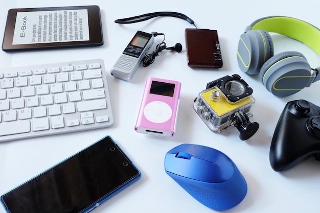 A close-up image showing a variety of colorful consumer electronics products ready for shipment. Items such as smartwatches, wireless earbuds, and smartphone accessories are meticulously arranged, representing a diverse range of high-demand goods for import.