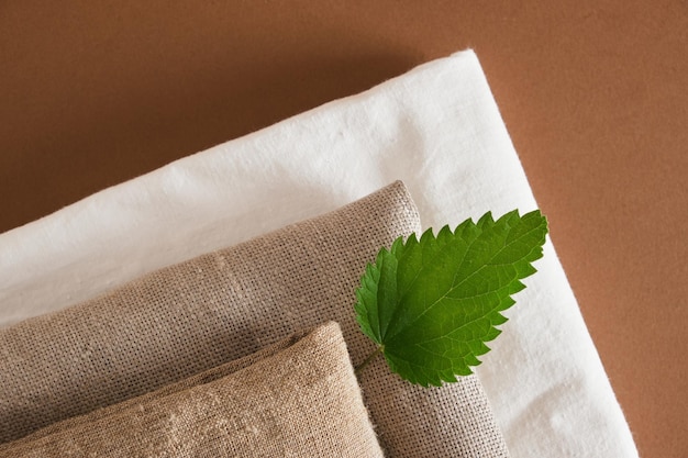 A close-up shot of sustainable fabrics and materials used in eco-friendly fashion, showcasing their texture and earthy tones. The image reflects a commitment to environmental responsibility.