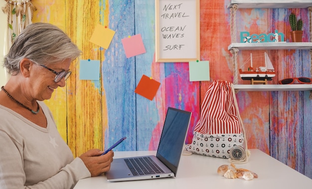 A digital marketing specialist working on a laptop in a colorful coworking space, analyzing social media metrics and adjusting online advertising campaigns.