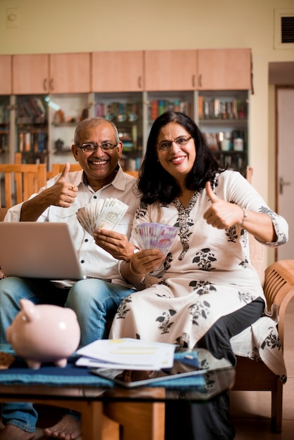 A Colombian family celebrating financial relief in their living room, showing them happy and relaxed.