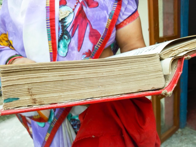 A close-up of a Colombian law book, specifically open to a page discussing consumer rights and debt regulations. The image should convey the importance of knowing your legal rights during debt negotiation.