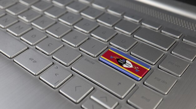 Close-up of a laptop screen displaying the Colombian Superintendency of Industry and Commerce (SIC) trademark database search page with multiple similar trademark entries, highlighting the importance of conducting thorough searches to avoid trademark conflicts. The scene is set in a modern office to emphasize the setting of trademark business.
