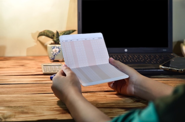 A medium, eye-level shot focusing on hands filling out an electronic form labeled 
